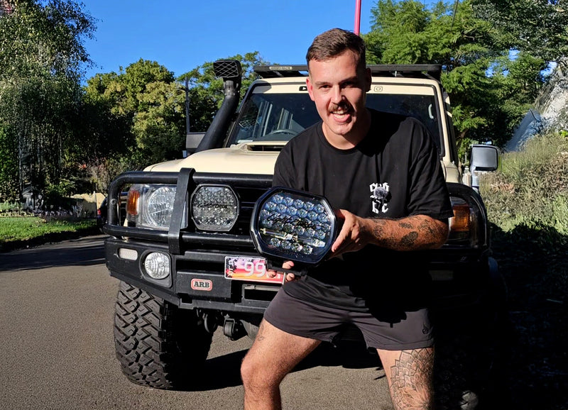 Sam Young 4x4 LandCruiser flexing over rocks on a technical track